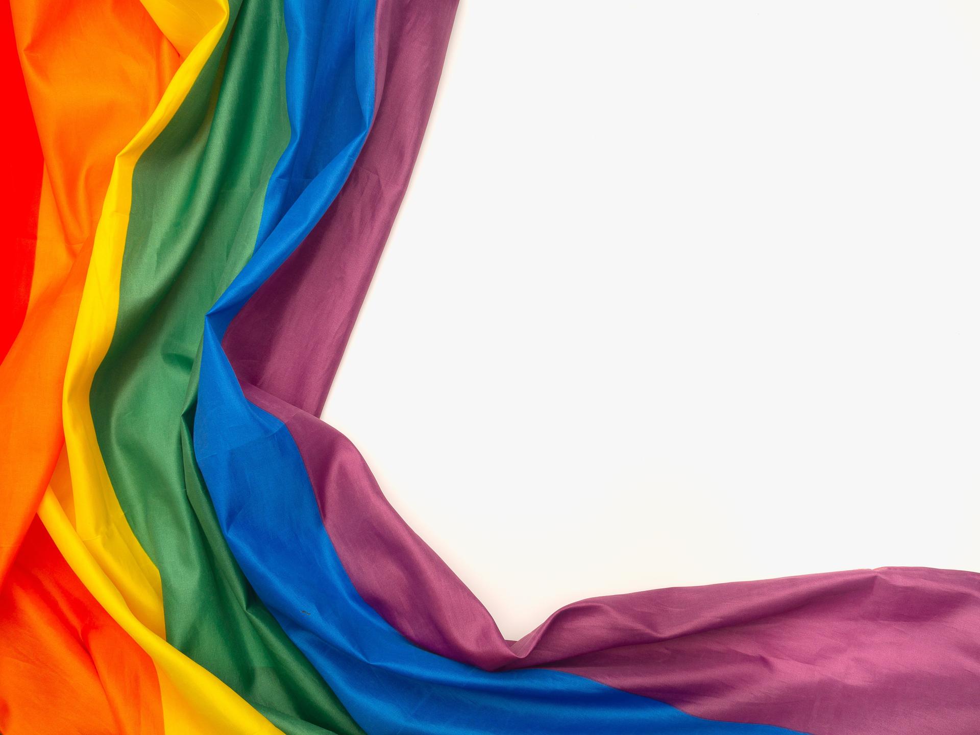 Rainbow flag isolated on white background with copy space for text.